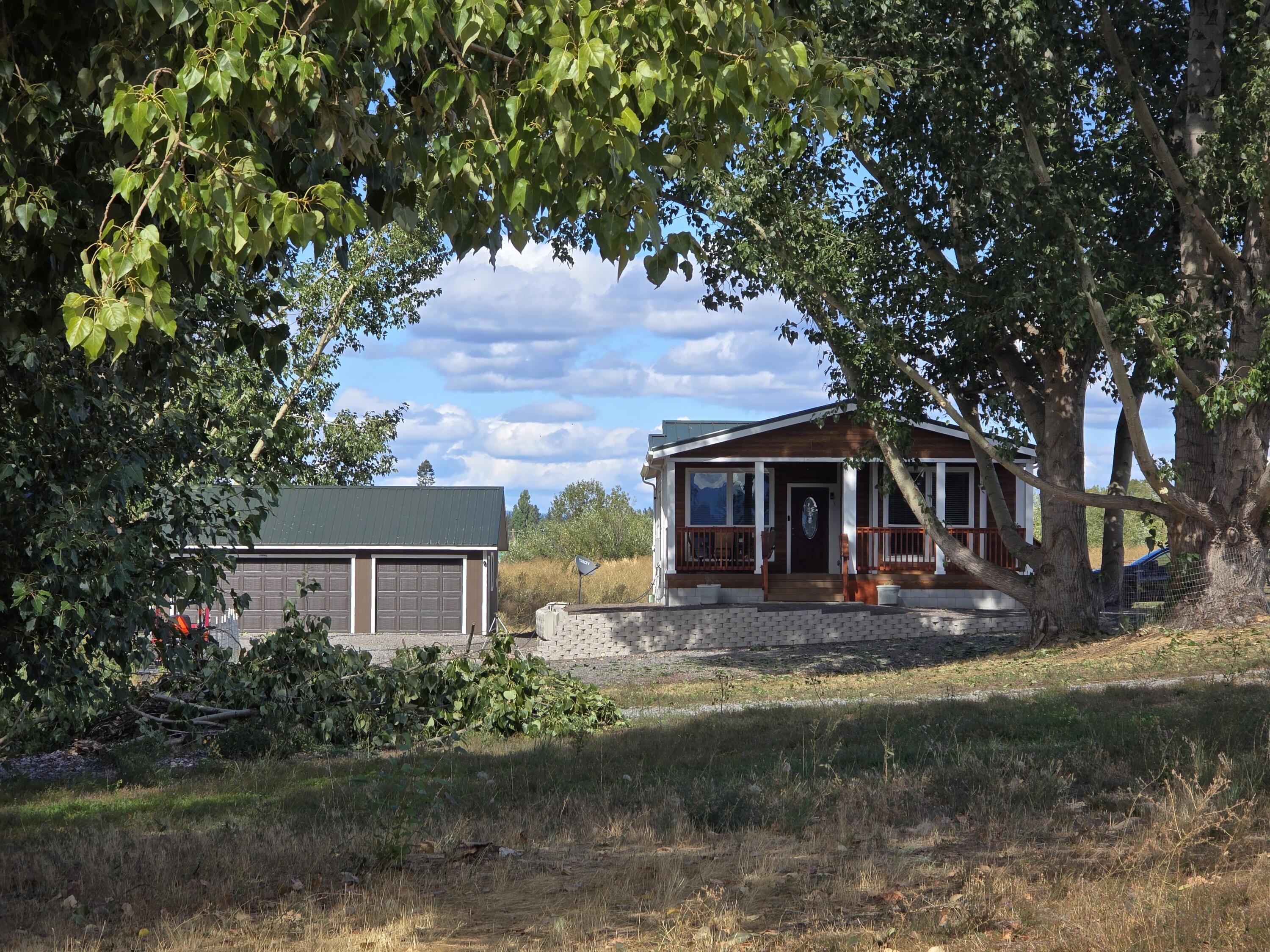 32158 Modoc Point Road Chiloquin, OR 97624 - Photo 19 of 37 a view of a yard in front of a house with large trees