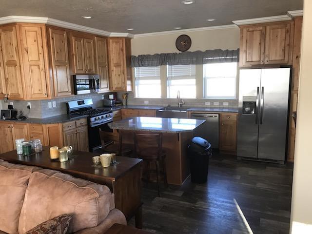 32158 Modoc Point Road Chiloquin, OR 97624 - Photo 5 of 37 a kitchen with stainless steel appliances granite countertop a stove a sink and a refrigerator