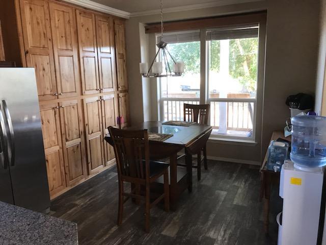 32158 Modoc Point Road Chiloquin, OR 97624 - Photo 7 of 37 a view of a dining room with furniture window and wooden floor