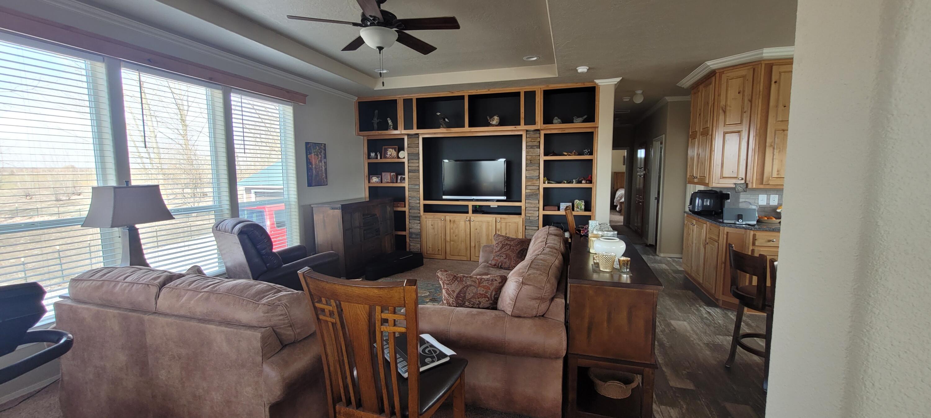 32158 Modoc Point Road Chiloquin, OR 97624 - Photo 8 of 37 a living room with furniture and a fireplace