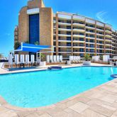 a view of a swimming pool with a lounge chairs