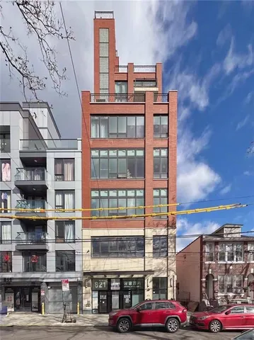 a front view of a building with lot of windows