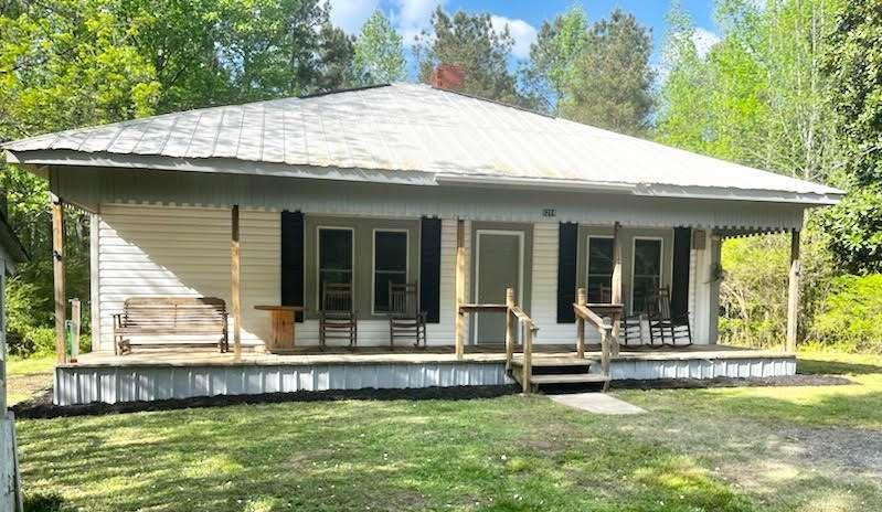 1214 Mt View-Club House Road Buchanan, GA 30113 - Photo 1 of 1 a view of a house with a swimming pool and a yard