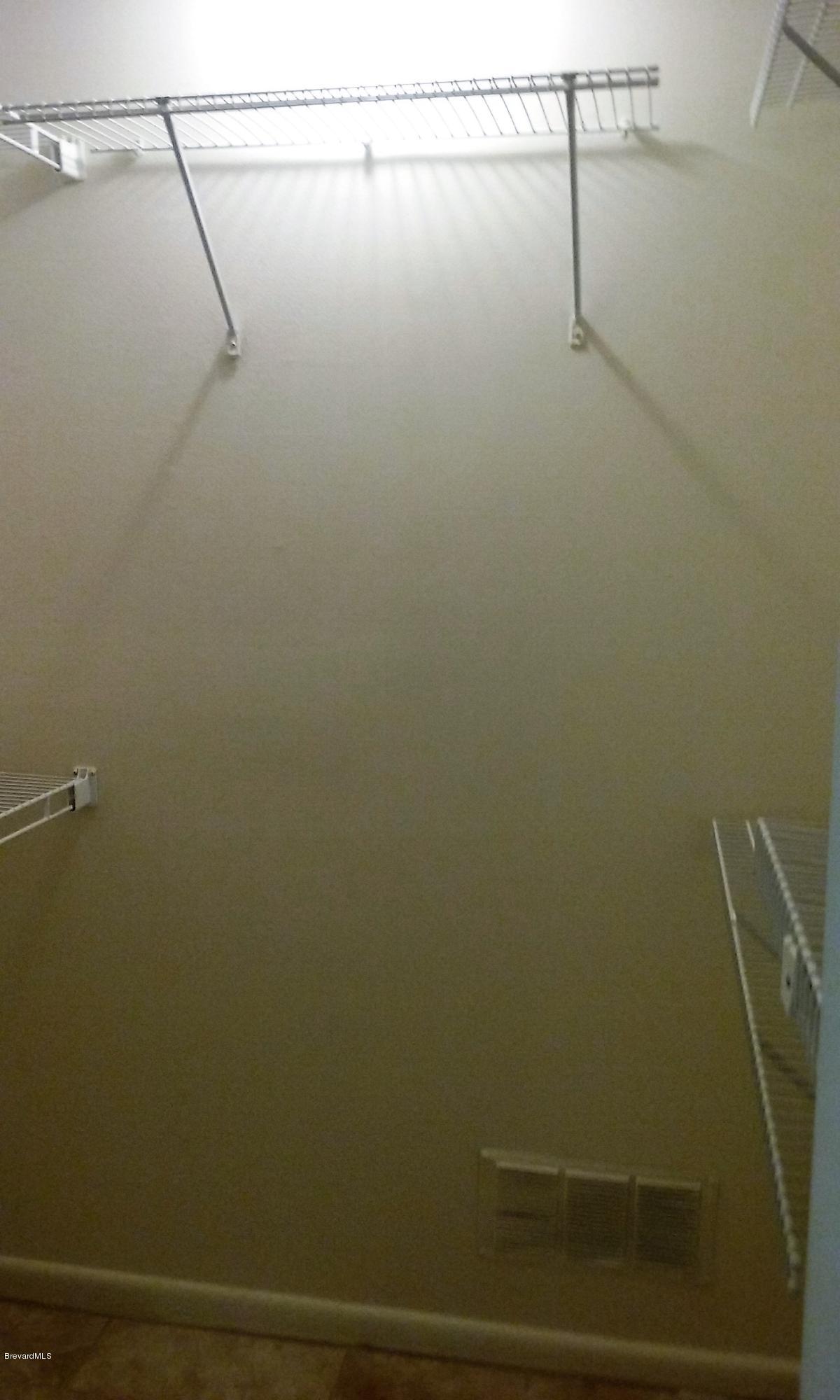 366 Myrtlewood Road Melbourne, FL 32940 - Photo 19 of 43 a view of small space with racks on the wall