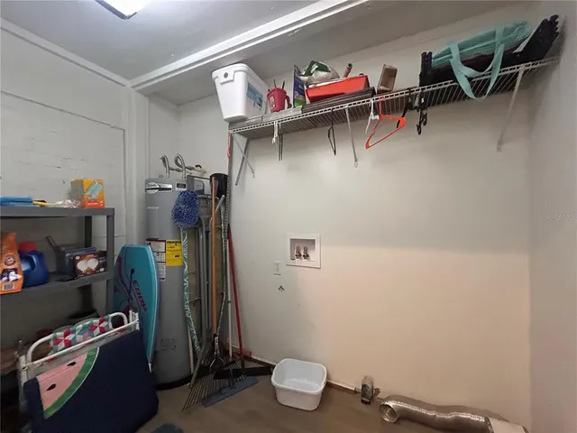 a view of storage and utility room with racks on the wall