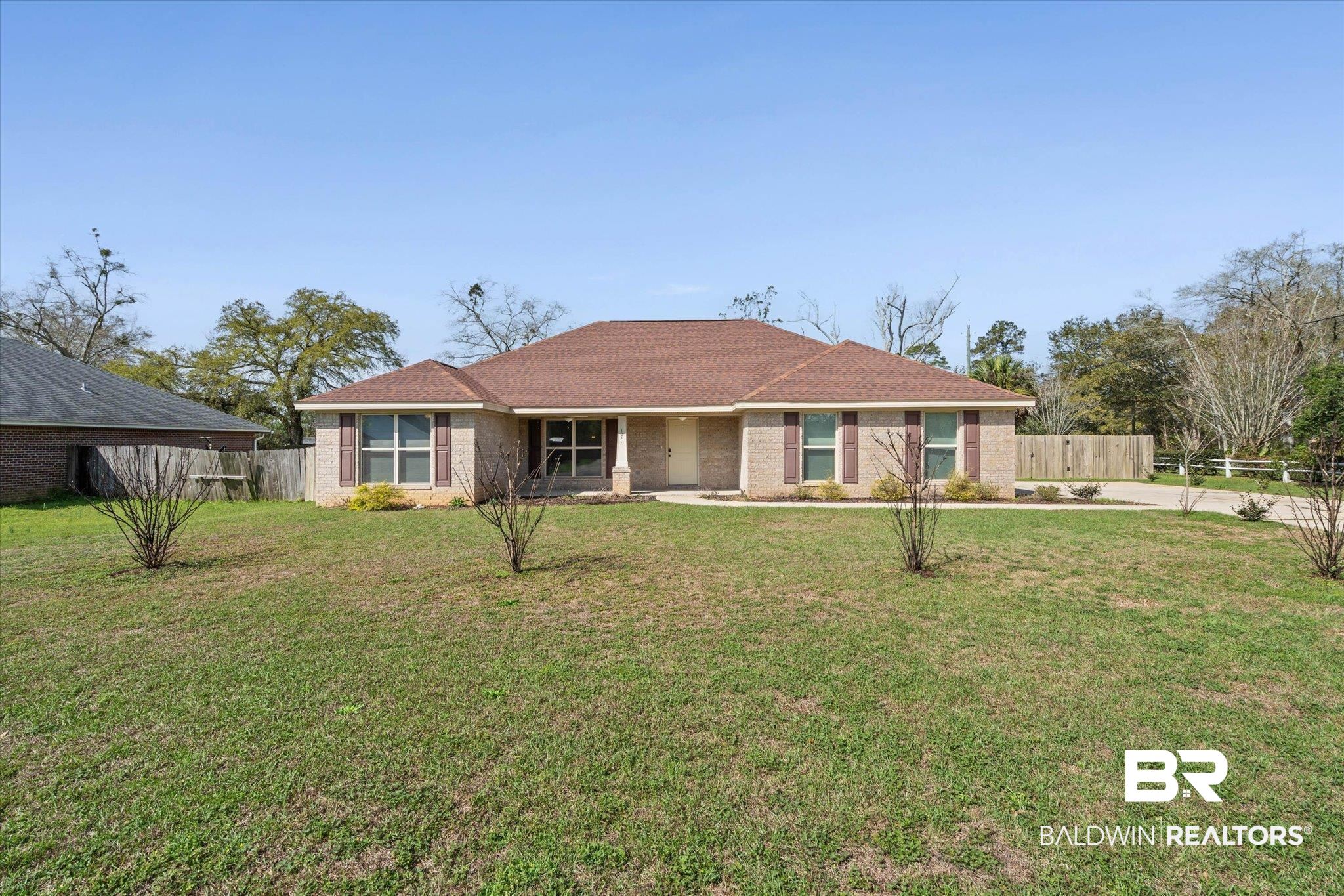 101 Washington Boulevard Foley, AL 36535 - Photo 31 of 32 Single story home with brick siding, roof with shingles, and a porch