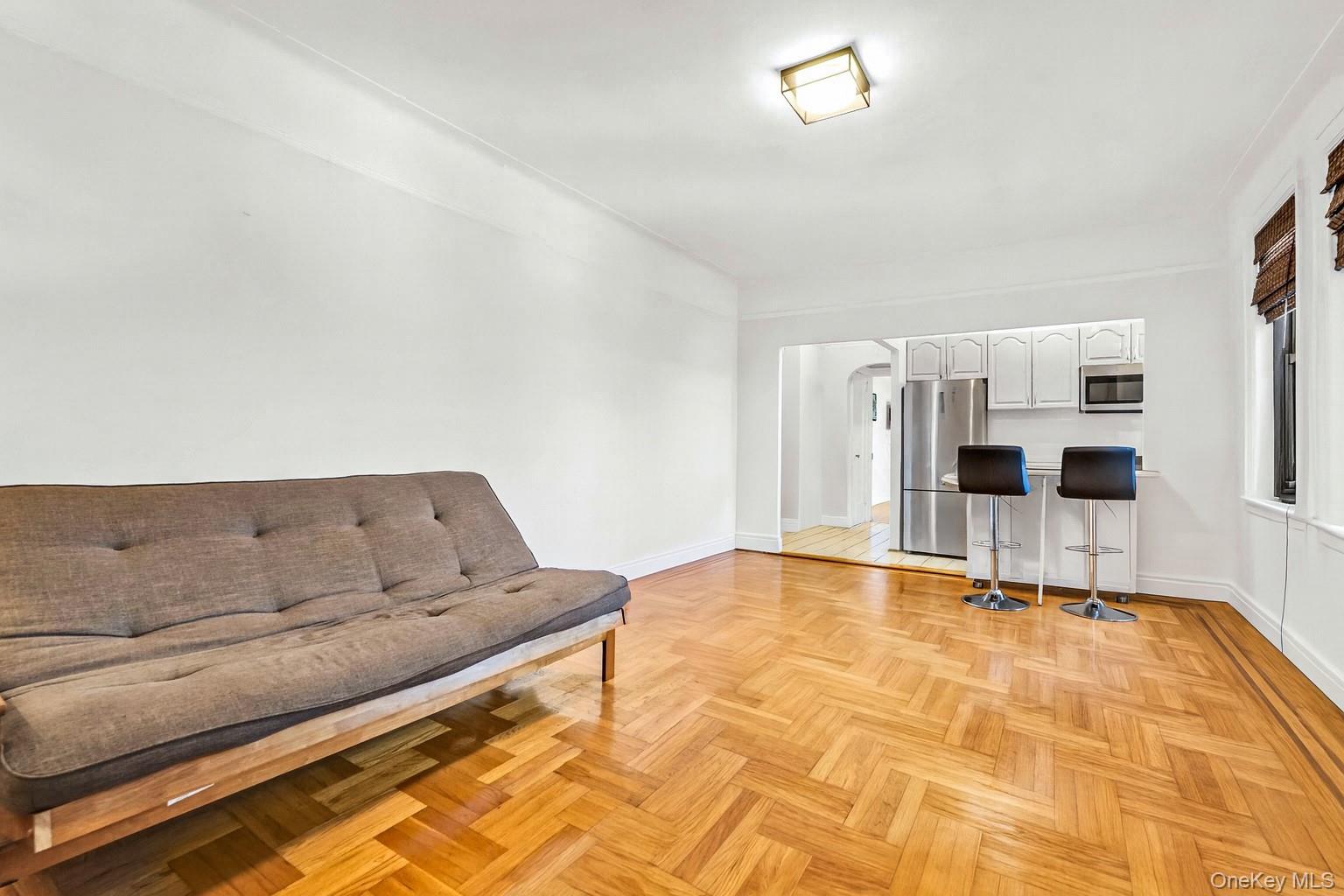 76-66 Austin Street, Unit 6F Queens, NY 11375 - Photo 3 of 11 a living room with furniture
