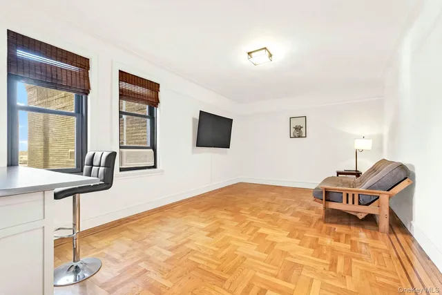 a bedroom with furniture and a window