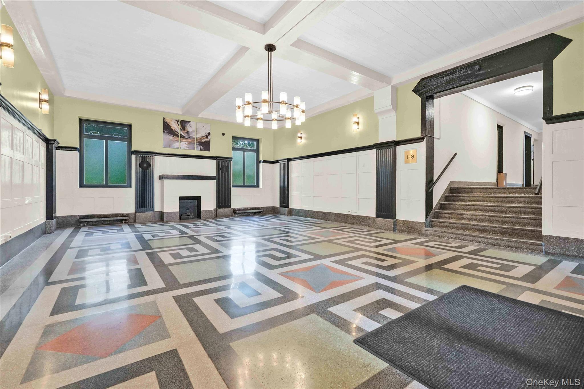 76-66 Austin Street, Unit 6F Queens, NY 11375 - Photo 8 of 11 a view of a livingroom with wooden floor and a fireplace