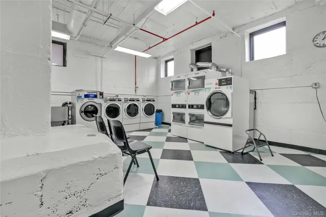 a view of a kitchen with a fireplace and wooden cabinets