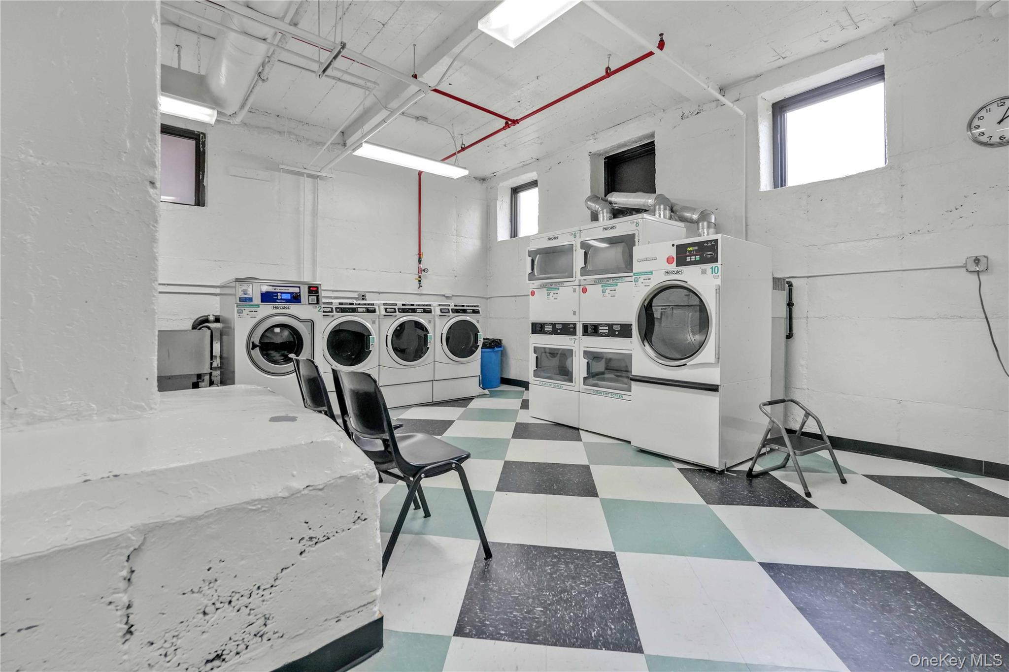 76-66 Austin Street, Unit 6F Queens, NY 11375 - Photo 9 of 11 a view of a kitchen with a fireplace and wooden cabinets