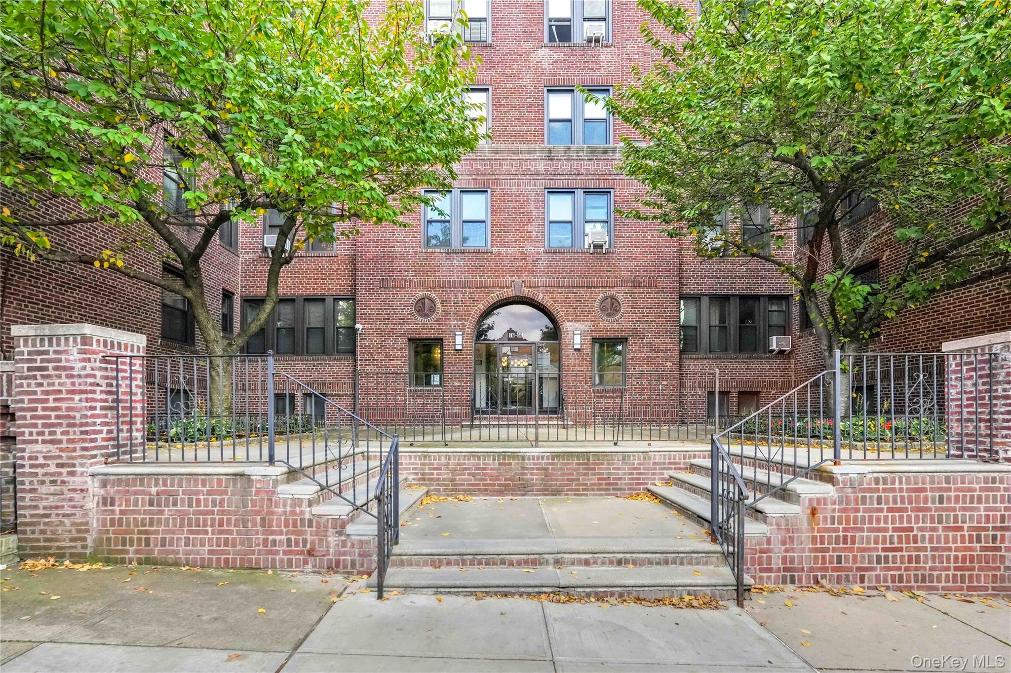 76-66 Austin Street, Unit 6F Queens, NY 11375 - Photo 10 of 11 a front view of a house with a garden