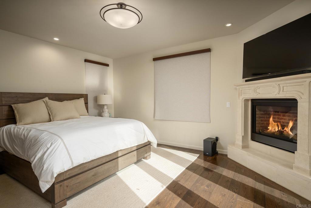 7029 Las Colinas Rancho Santa Fe, CA 92067 - Photo 7 of 10 a bedroom with a bed and a flat screen tv