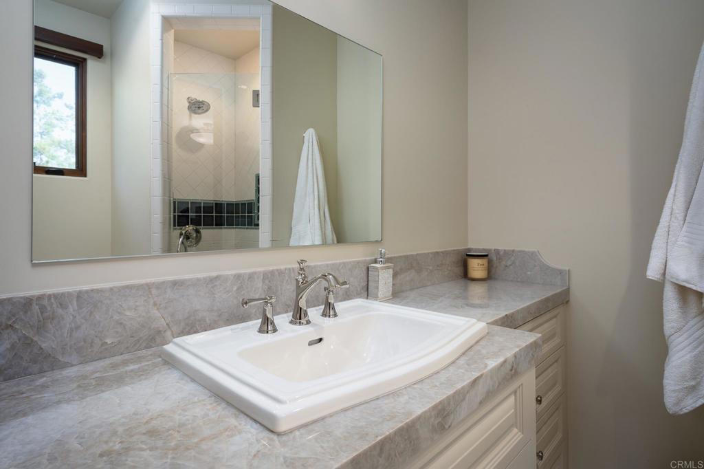 7029 Las Colinas Rancho Santa Fe, CA 92067 - Photo 8 of 10 a bathroom with a sink and a mirror