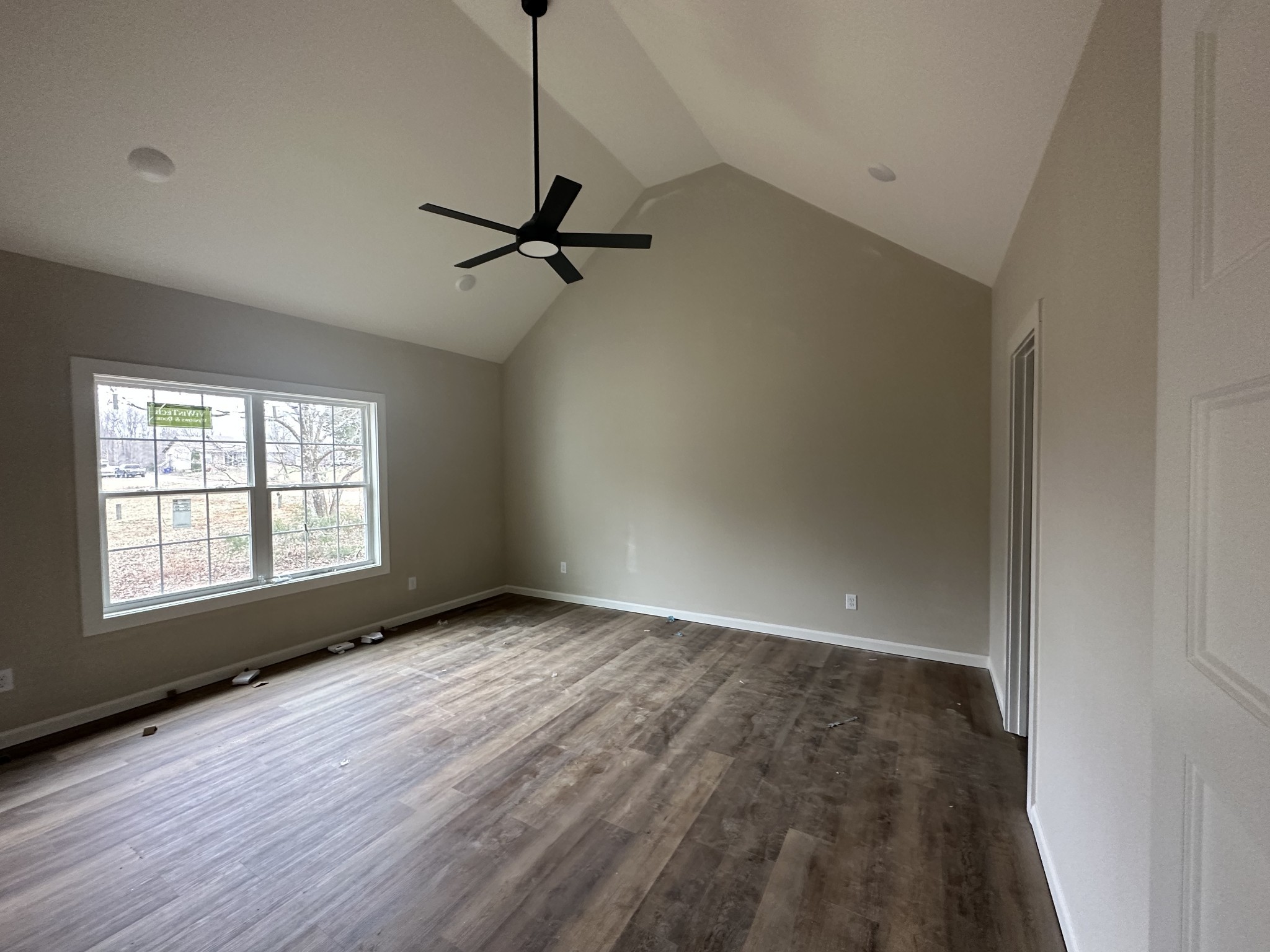 989 Mt Vernon Road Bethpage, TN 37022 - Photo 6 of 9 a view of an empty room with a window and wooden floor