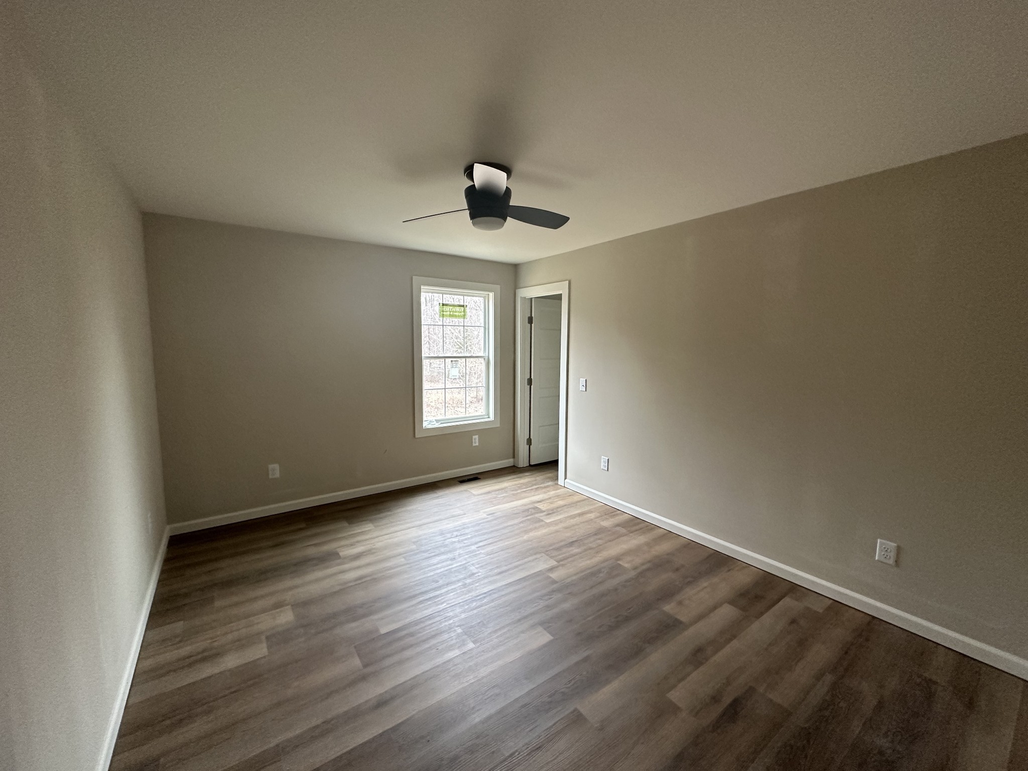 989 Mt Vernon Road Bethpage, TN 37022 - Photo 8 of 9 wooden floor in an empty room with a window