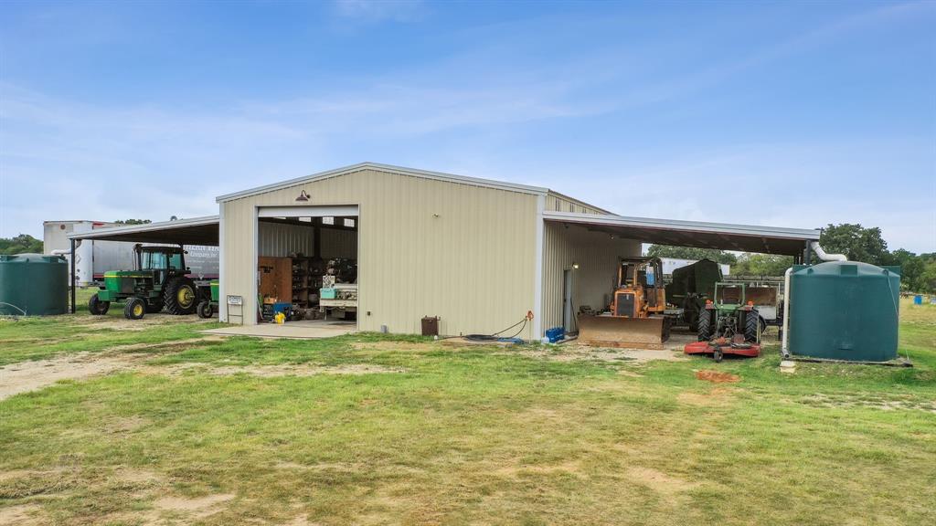 298 Townson Road Dublin, TX 76446 - Photo 20 of 40 a view of a room that has a large window and a table and chairs