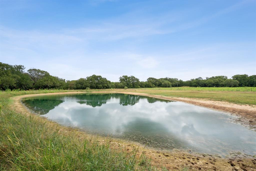 298 Townson Road Dublin, TX 76446 - Photo 2 of 40 a view of a lake with houses in the back