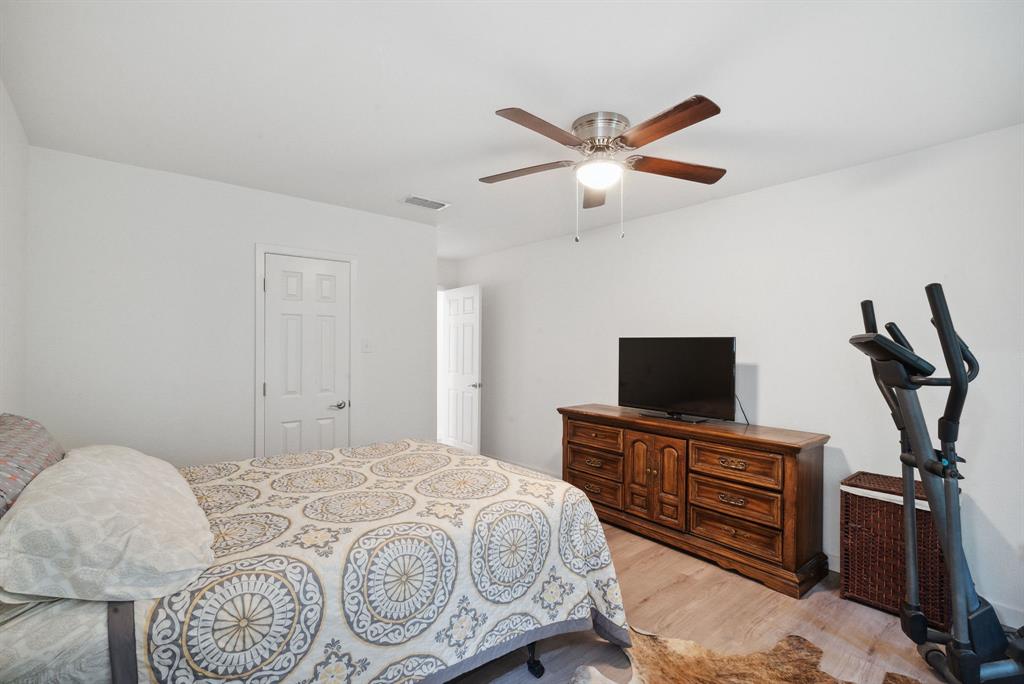 298 Townson Road Dublin, TX 76446 - Photo 31 of 40 a bedroom with a bed and a flat screen tv