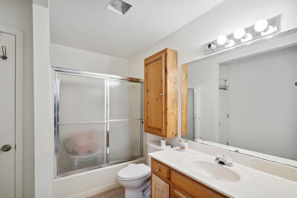 298 Townson Road Dublin, TX 76446 - Photo 33 of 40 a bathroom with a sink toilet and shower