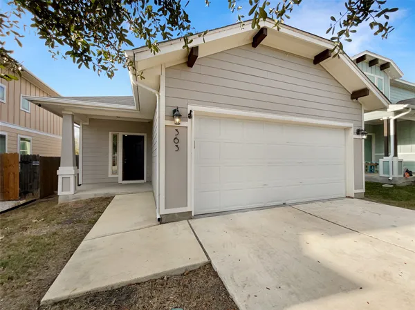 a view of a front door and a yard