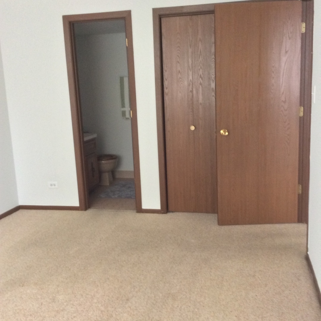 10643 Major Avenue, Unit 1C Chicago Ridge, IL 60415 - Photo 8 of 14 a view of a room with a wardrobe space