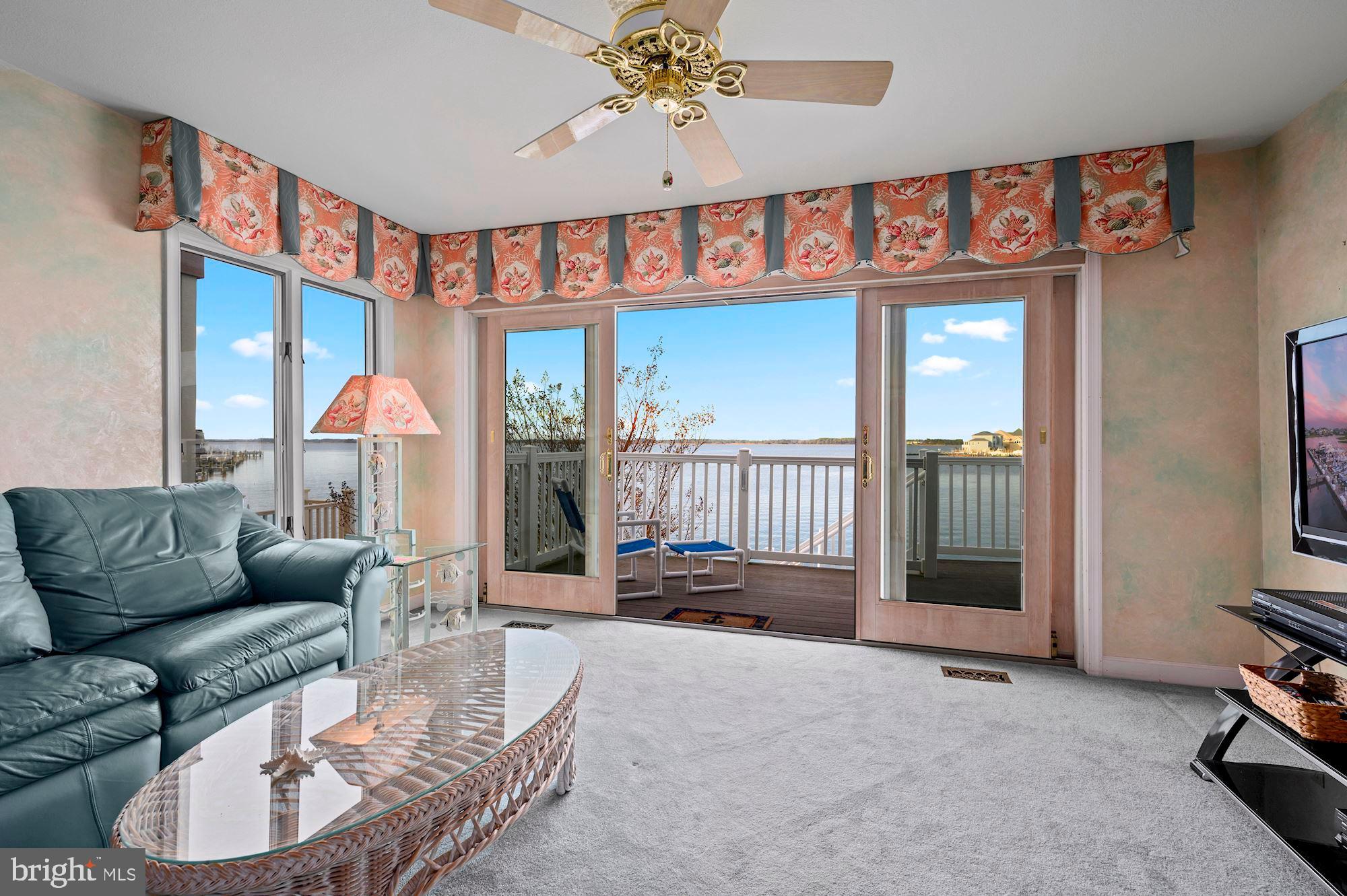 724 South Surf Road, Unit 1 Ocean City, MD 21842 - Photo 5 of 30 Main Level Family Room and Waterside Deck