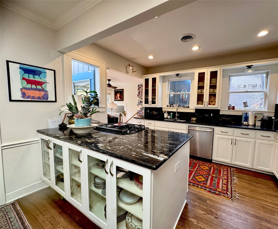 807 Leonard Street Austin, TX 78705 - Photo 13 of 32 a kitchen with stainless steel appliances granite countertop a stove a sink and a microwave