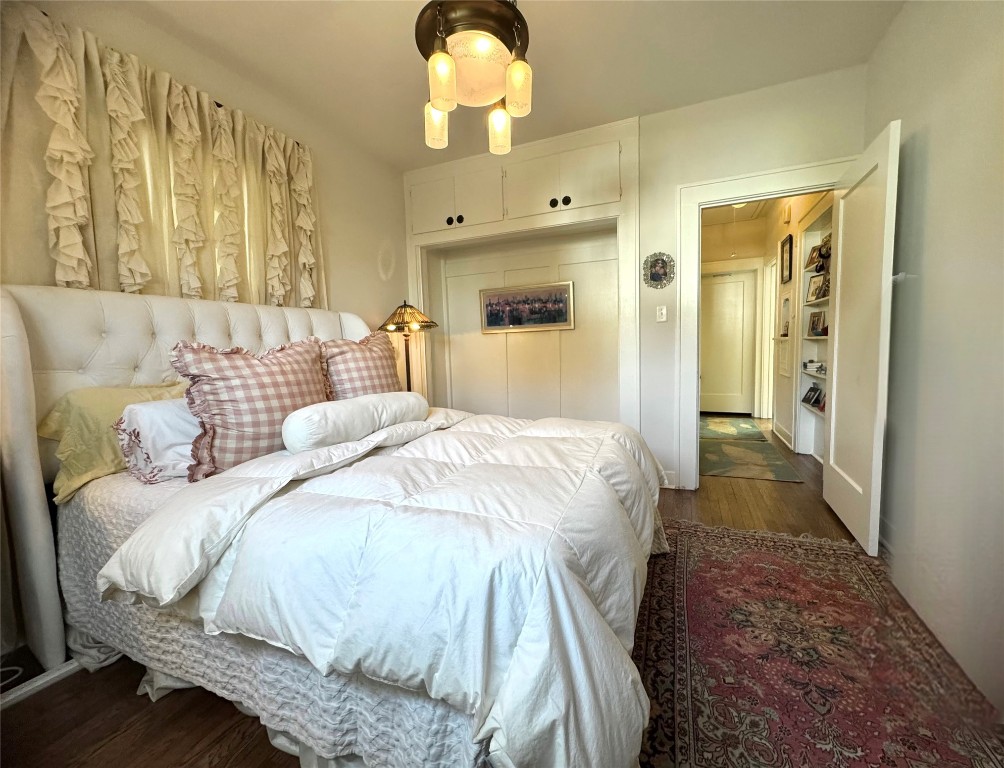 807 Leonard Street Austin, TX 78705 - Photo 16 of 32 a spacious bedroom with a bed and a window