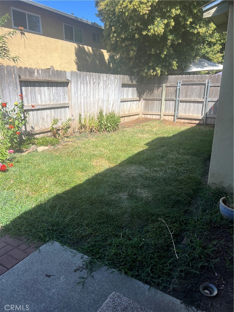 8 San Gabriel Drive, Unit B Chico, CA 95973 - Photo 1 of 7 a backyard with garden and plants
