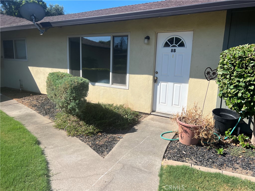 8 San Gabriel Drive, Unit B Chico, CA 95973 - Photo 3 of 7 a front view of a house with garden