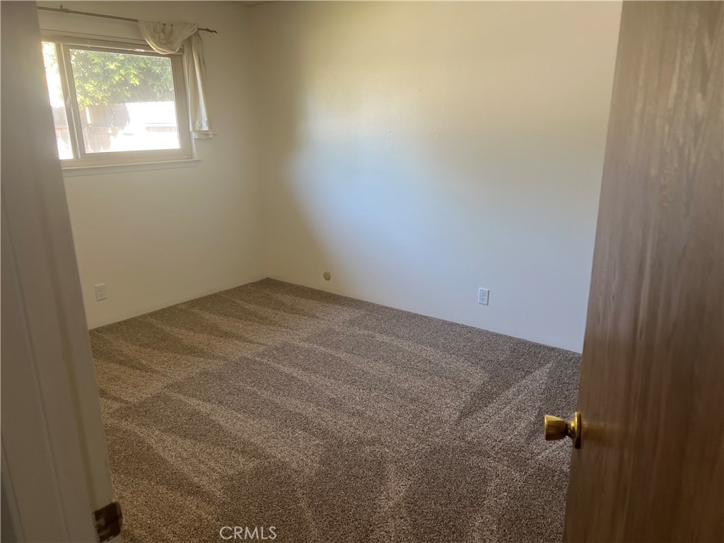 8 San Gabriel Drive, Unit B Chico, CA 95973 - Photo 7 of 7 an empty room with a window