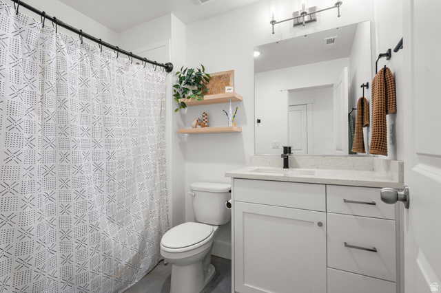 2706 West Maple Street, Unit 285 Mapleton, UT 84664 - Photo 21 of 36 Contemporary bathroom featuring a single vanity with a light-colored countertop and a matte black faucet