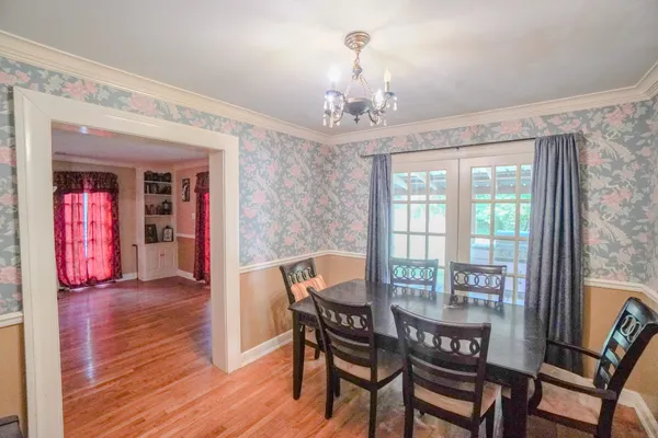 a view of a livingroom with furniture and a window
