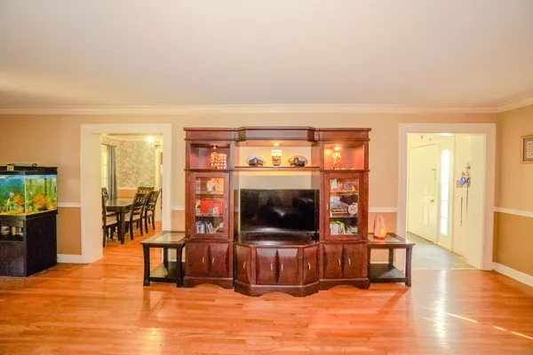 a view of a dining room with furniture window and wooden floor