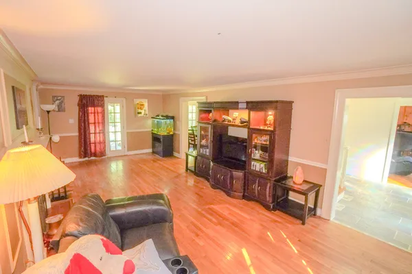 a view of a dining room with furniture window and wooden floor