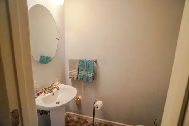 a kitchen with a refrigerator and a stove top oven