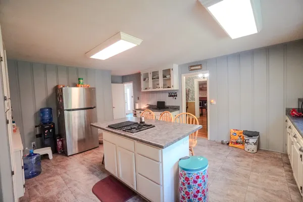 a kitchen with stove and cabinets