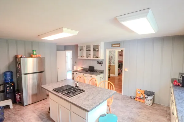 a kitchen with granite countertop cabinets stainless steel appliances and a sink