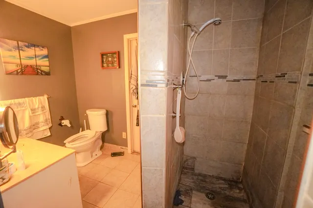 a room with wooden floor and a window