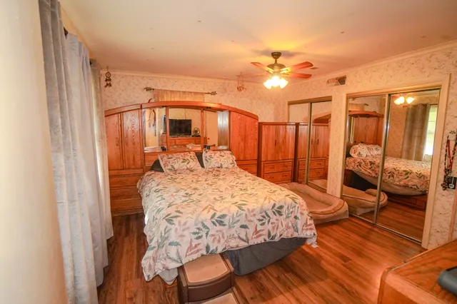 a view of a room with gym equipment and a window