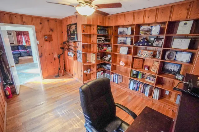 a view of livingroom with furniture and book shelf