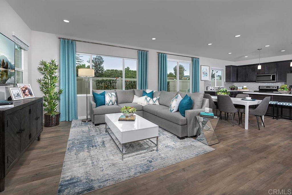 10656 Busch Street Spring Valley, CA 91978 - Photo 2 of 4 a living room with furniture and a large window