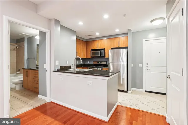 a kitchen with a refrigerator stove and microwave