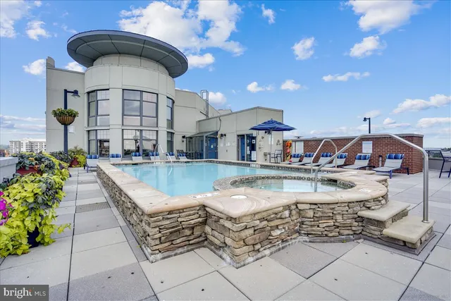 a view of a swimming pool with a patio