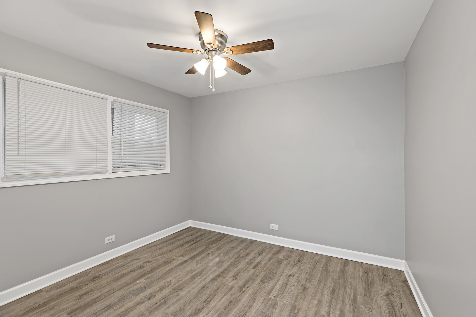 432 West Hickory Street Chicago Heights, IL 60411 - Photo 11 of 23 wooden floor in an empty room with a window