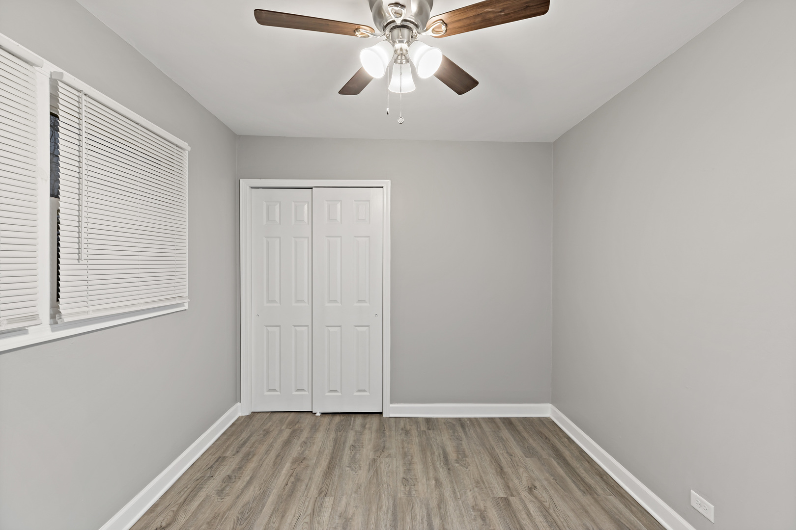 432 West Hickory Street Chicago Heights, IL 60411 - Photo 14 of 23 a view of an empty room with window and chandelier fan