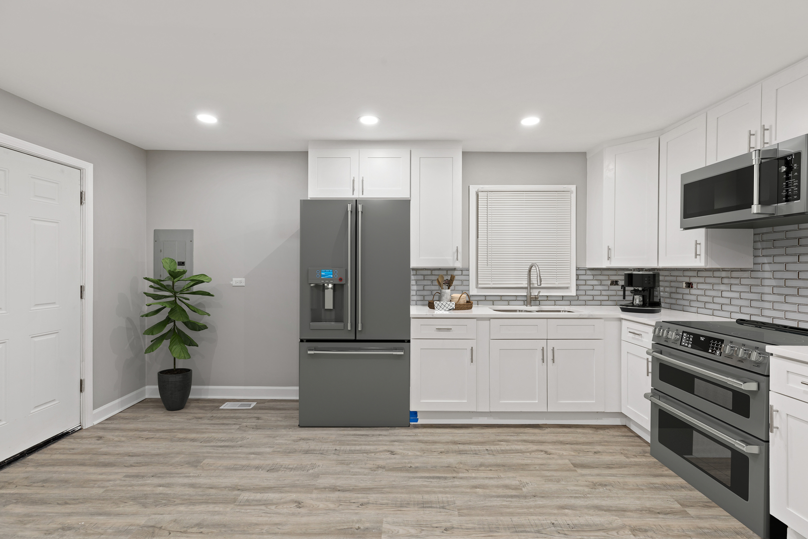 432 West Hickory Street Chicago Heights, IL 60411 - Photo 3 of 23 a kitchen with a refrigerator and a sink
