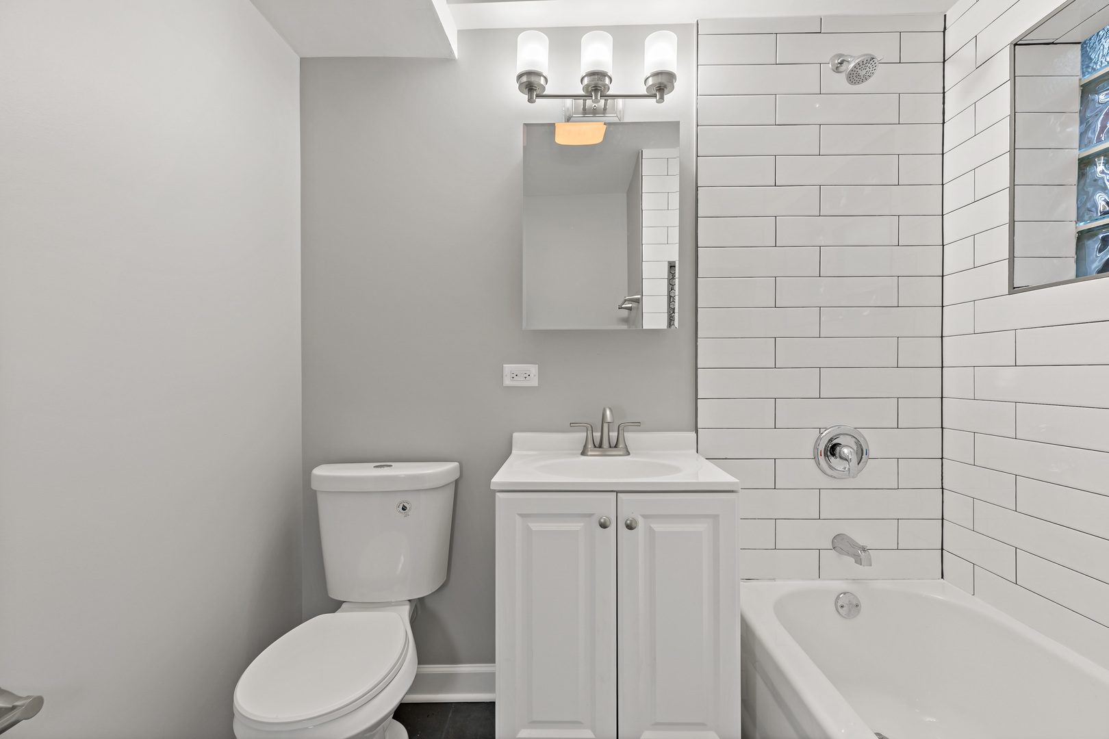 432 West Hickory Street Chicago Heights, IL 60411 - Photo 10 of 23 a bathroom with a toilet sink and mirror