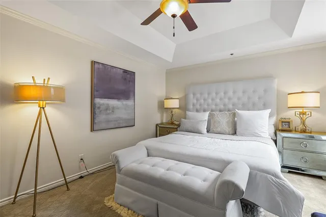 a bedroom with a bed and a lamp